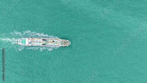 Industrial Cargo Tanker Ship Navigating Through Open Turquoise Ocean Waters