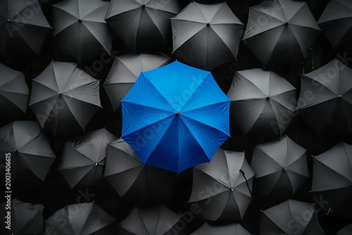 Blue Umbrella Standing Out Among Gray Umbrellas – Symbol of Innovation and Leadership
