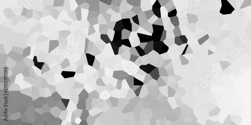 Abstract mosaic pattern with irregular polygons in grayscale tones creating a textured background effect