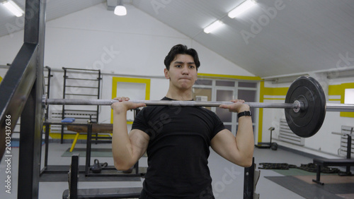 Photography Man working out on gym crossover machine
