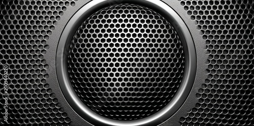 Close-up of a dark metallic speaker grille with a circular pattern, showcasing a modern and industrial design.