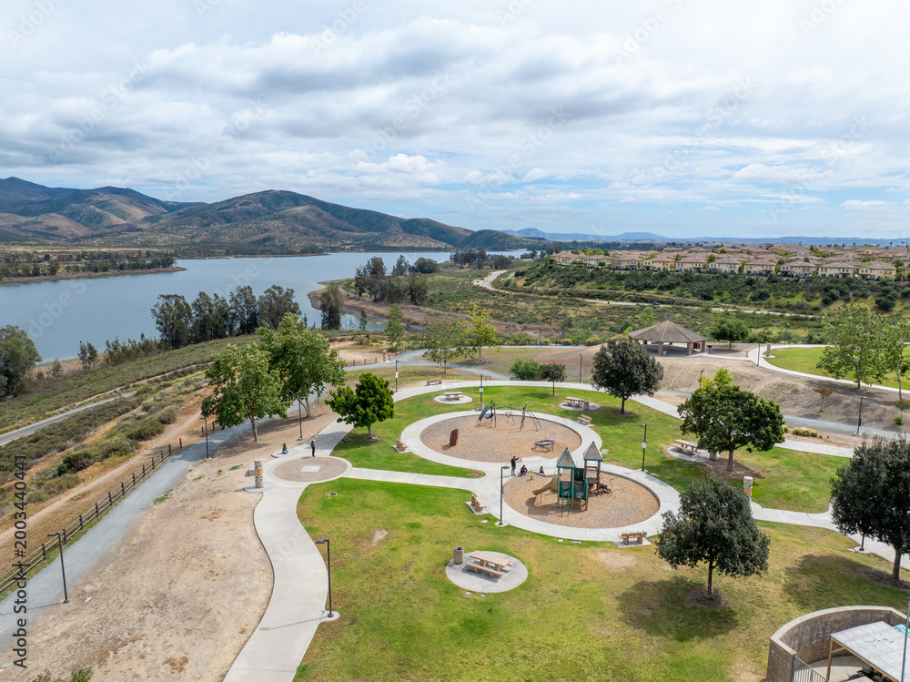 Fototapeta premium Aerial view of Otay Lakes County Park in Chula Vista, California, a scenic view of a mountain range, the lake. High quality photo