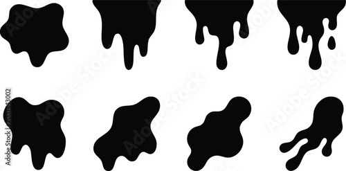 Variety of black ink splatters and drips in different shapes and