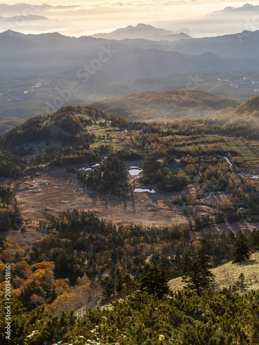 Sunrise over misty mountain valley with sea of clouds, autumn landscape in Japan