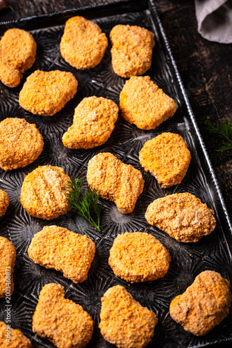 Raw uncooked frozen chicken nuggets