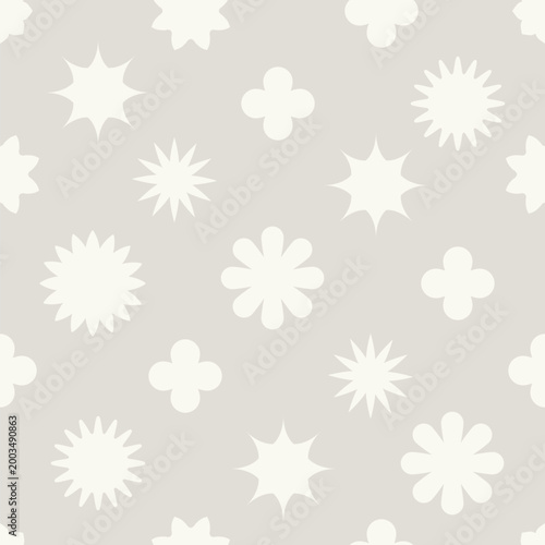Seamless pattern offering a repeating texture with stylized flowers, subtle quatrefoil shapes, and starburst forms in off white on a muted light grey background, perfect for contemporary design