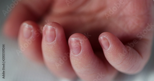 Tablou pe pânză Tiny little newborn hand macro close-up