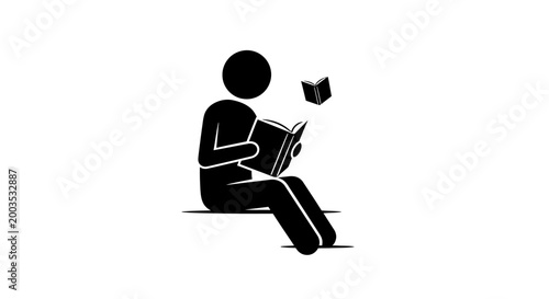 Person sitting and reading book.