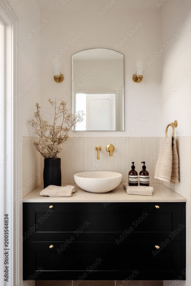 Fototapeta premium Modern Bathroom Vanity with Vessel Sink, Black Cabinet, and Gold Fixtures - Elegant Home Decor