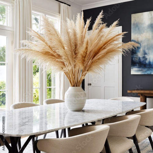 Elegant Dining Space With a Large Vase of Pampas Grass Center on a Table
