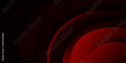 Radiant concentric red circles on a dark background. The image evokes depth and structure through the repetition of the circular shape, creating a visual rhythm.