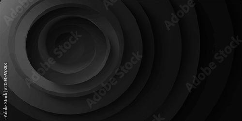 A captivating, abstract spiral in shades of gray forms a visually striking display. The interplay of light and shadow highlights the form and adds depth.