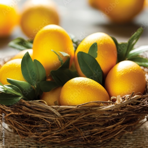 Golden Eggs in a Basket With Green Leaves on a Wooden Table During Daylight