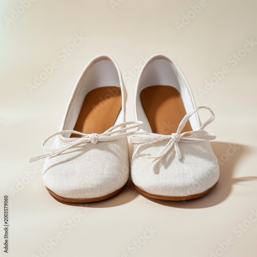 White Shoes With Bows Placed on a Light Background in a Bright Room