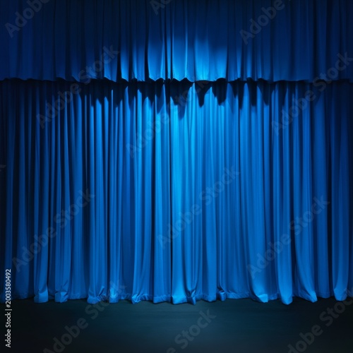 Blue Curtains Hanging on a Stage Before a Performance at Night