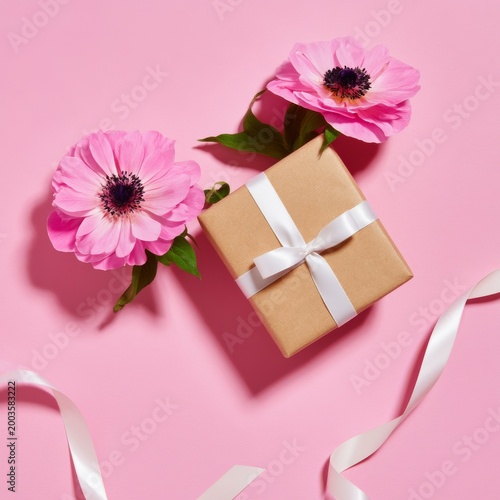 Gift Wrapped With Pink Flowers on a Bright Pink Background for Special Occasions