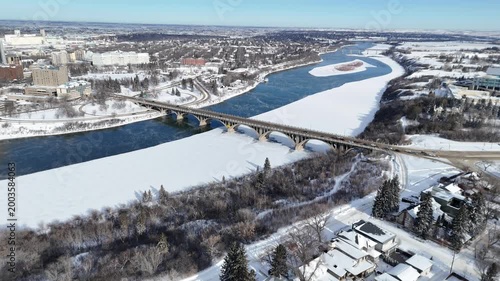 Frozen river winds through a snowy city park