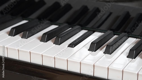 Closeup of moving piano keys on automatic play