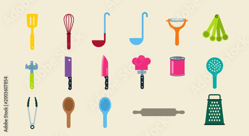 Assortment of kitchen utensils on a beige backdrop