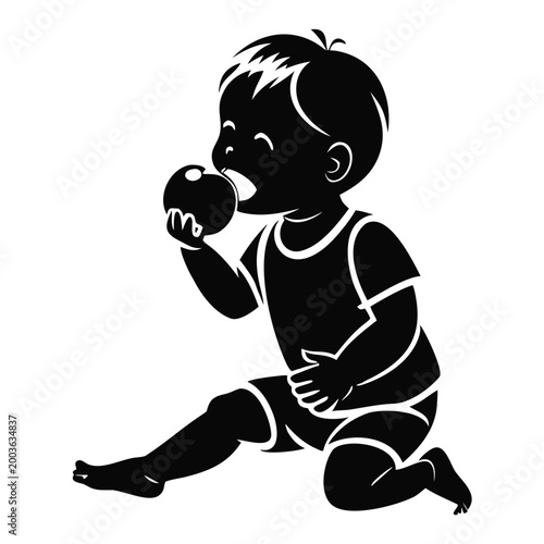 Toddler enjoying apple with joyful expression while sitting on the floor. Child takes a big bite of shiny apple, playful moment captured in silhouette. Concept of healthy eating for children.
