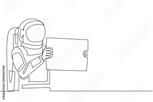 Gorgeous monochrome continuous line drawing presents a young handsome astronaut holding a large blank sign sideways. It perfectly fits an advertising concept for a public awareness poster.