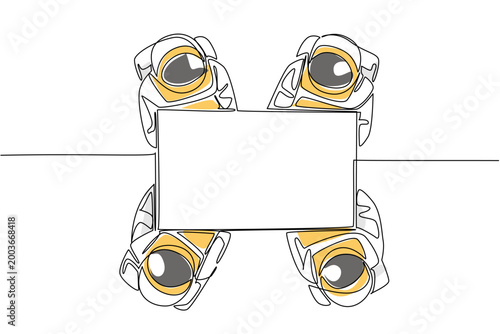 Brilliant one line drawing of four astronauts holding a wide paper business map in color from a top view. This universe exploration science concept is an outstanding choice for an exhibition banner.