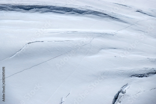 Photos Abstract Glacier Surface with Crossing Tracks and Snow Texture Background Spaghe
