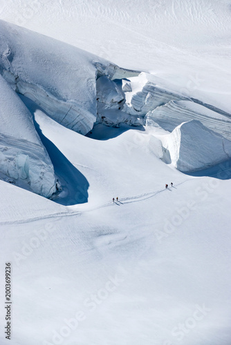 Risk management on glacier expedition, team navigating crevasse zone with careful planning and safety awareness. Spaghetti Tour Route Rifugio Gnifetti Alagna Valsesia, Piedmont / Italy - July 19 2023