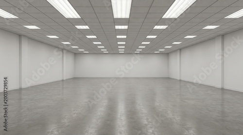 The interior of a large empty room with a shiny floor and recessed lighting in the ceiling