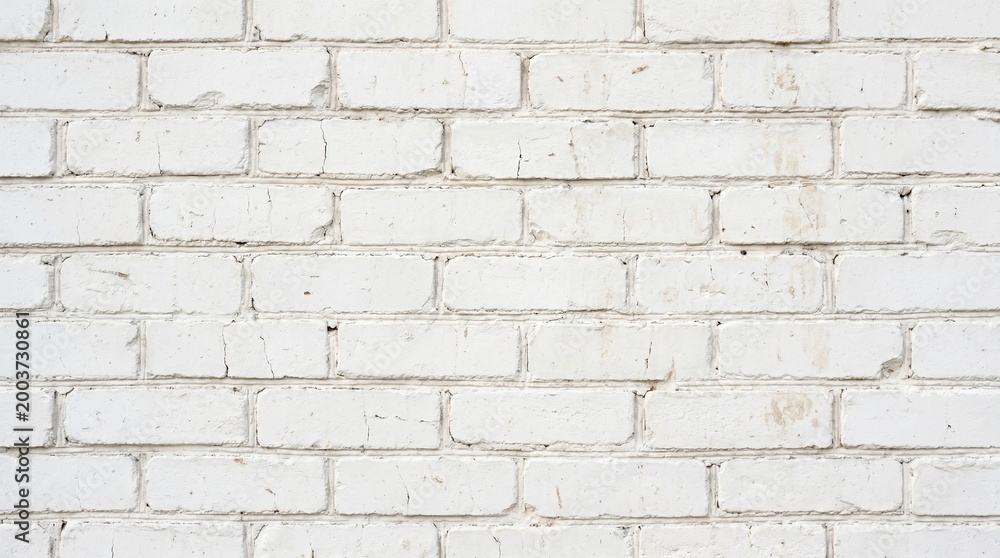 Obraz premium A close-up view of a white brick wall with a rough texture