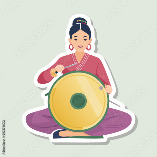 Woman playing a traditional drum