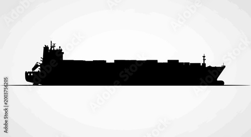 Silhouette of a large cargo ship.