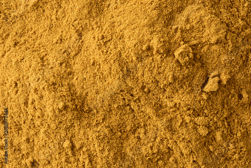 fine ground spice powder in full frame texture, aromatic seasoning curry powder top view, kitchen background concept