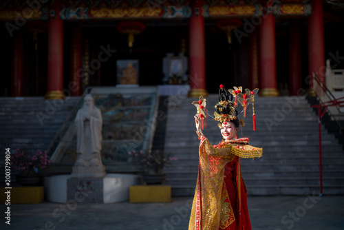 Chinese woman performing traditional dance at temple