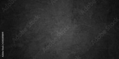 Dark charcoal grunge wall texture background. Dark black rough grunge surface with smoke edge. Black texture chalk board and black board.