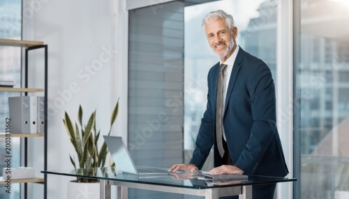 The Confident Executive: A distinguished executive stands with poise in a modern office setting. the epitome of success and leadership.