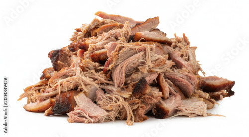 Pile of shredded slow cooked pulled pork meat with crispy charred edges isolated on white background