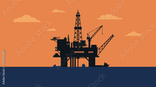 Offshore oil rig at sunset silhouette.