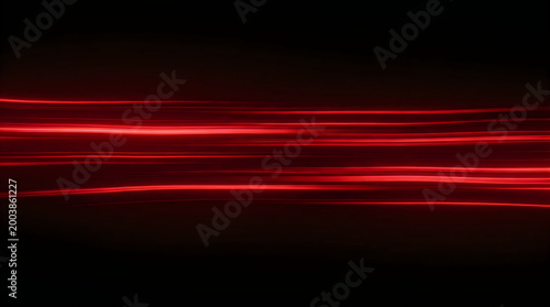 Abstract red light streaks moving fast on a dark background