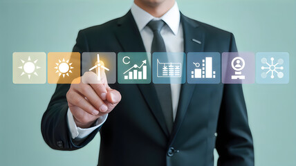 Businessman touching digital screen with icons representing green energy and business growth.
