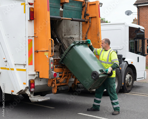 Garbage Truck Worker Loading Waste Container