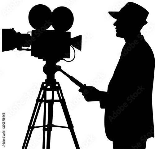 Silhouette of a Cameraman Operating a Vintage Motion Picture Camera on a Tripod