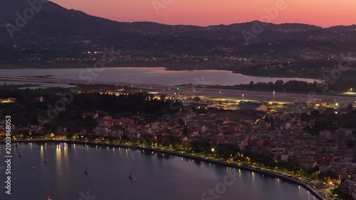 Stunning Aerial Sunset View of Corfu Coastal Town and Airport Runway at Twilight, Ionian Sea, Greece