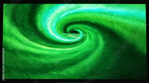 An abstract swirling vortex of green and blue colors, creating a mesmerizing and dynamic visual effect on a dark background
