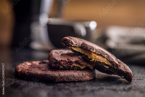 Photos Gooey Caramel Filled Chocolate Cookies Stacked With Coffee Cup Dark Moody Desser