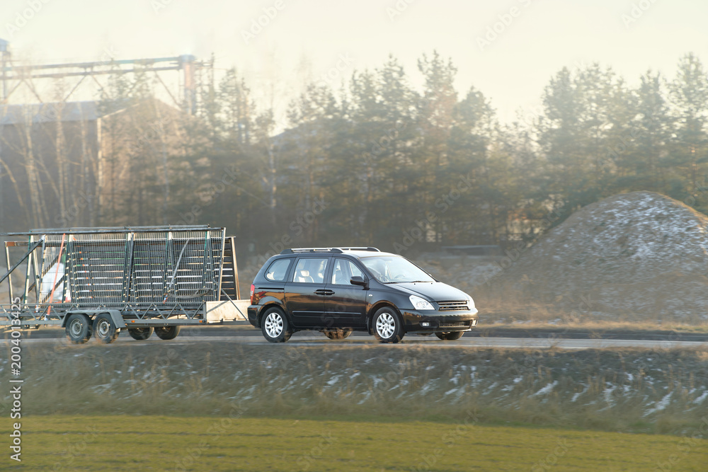 Fototapeta premium Highway vehicle with covered cargo trailer