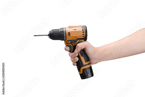 Foto Person holding a portable orange and black cordless electric power drill and scr