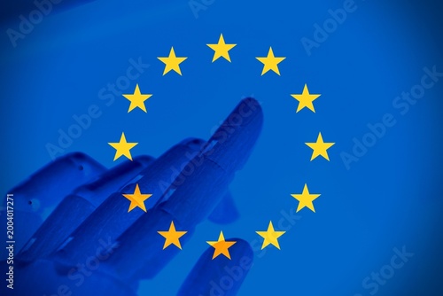 Creative representation of AI regulation in the European Union, with robotic hand and EU flag symbolizing balance between innovation and legal control in the age of artificial intelligence.