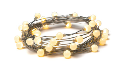 Coiled string of glowing warm white led fairy lights isolated on a plain white background view