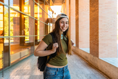 Young female student smiling on university campus